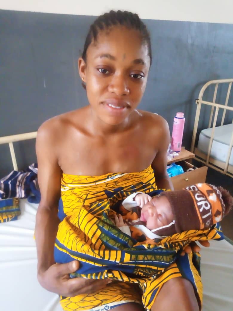 mother holding new baby named Inem Ugbana